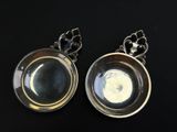 pair of silver plated spoons with a moon in the center