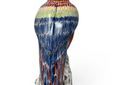 an image of a figurine of a bird on a white background