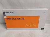 the box of the dogee tab a9 is open on a white surface