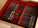 a wooden box with a set of silverware in it
