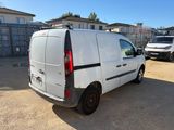 the white van is parked in the parking lot next to other cars