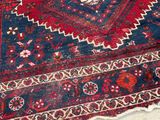 a very old rug with a lot of different designs on it