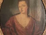 portrait of a woman in a red dress in a gold frame