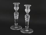 pair of crystal candlesticks on a black background