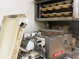 an image of a commercial kitchen with a lot of food on the counter