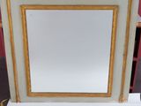 a mirror that is sitting on top of a table