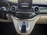 the interior of a car with a steering control and dashboard controls
