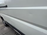 a white van parked on the side of the road