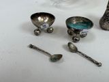 a lot of silver objects on a white table