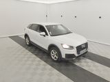 the white audi suv is parked in a clean garage