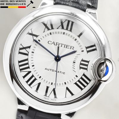 a close up of a watch with roman numerals on it