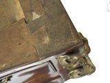 a close up of a wooden table with a clock on it