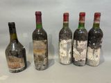 three bottles of wine are sitting next to each other on a table