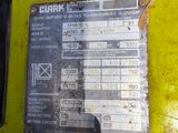 a close up of a metal sign on the side of a yellow truck