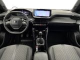 the interior of a small car with a steering wheel and dashboard