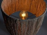 an image of a wooden lamp with a light bulb inside of it