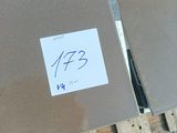 a person holding a cardboard box with a sticker on it