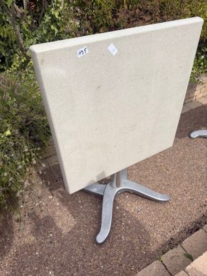 a white table that is sitting on the side of the road
