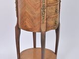 a small wooden table with a drawer on it