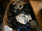 a box full of wires and wires sitting on a desk