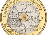 a close up of a coin with a picture of a building in the background