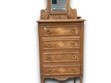 an image of a dresser with a mirror on top of it