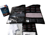 three bags of clothing and a box of toilet paper