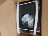 a black trash can inside of a cardboard box