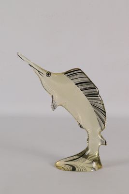 silver plated marlin fish figurine on a white background
