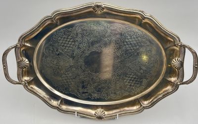 an antique silver tray with handles and handles