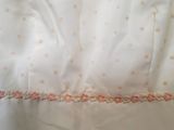 a white shirt with pink polka dots on it