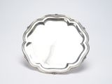 an antique silver plate on a white background with a white background