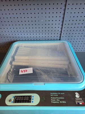 an image of a blue and black refrigerator with a price tag on it