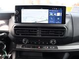 the dashboard of a car with a gps device in the center