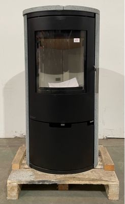 an image of a black stove sitting on top of a wooden pallet