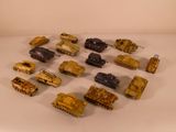 a lot of toy army vehicles on a white surface