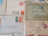 many different types of letters and envelopes on the table