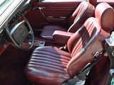 an image of a car with red leather seats and a steering wheel