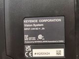 a close up of a laptop with a key on it