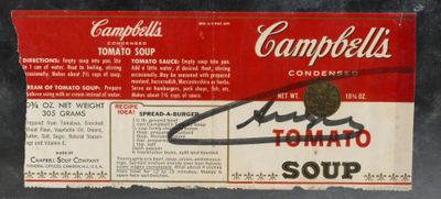an old campbell ' s tomato soup label with a handwritten signature