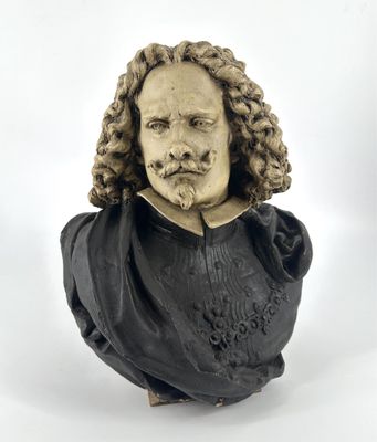 une image représentant le buste d'un homme aux cheveux bouclés