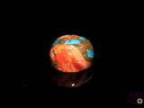 an image of a marble ball on a black surface