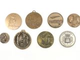 a lot of coins that are on a white surface