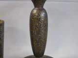 two vases sitting next to each other on a table
