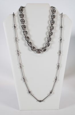 a close up of a necklace on a mannequin display