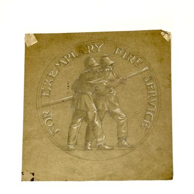 a bronze plaque with a picture of a man and a woman