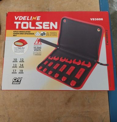 a box of tools sitting on a table next to a pair of scissors