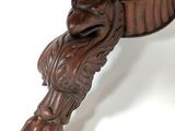 a wooden table with a bird on top of it