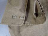 a close up of a shirt with buttons on it