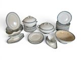 a lot of dishes and bowls that are sitting on a table